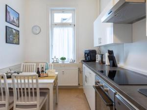 a kitchen with a counter and a table and chairs at Apartment Apartment 54 by Interhome in Bad Arolsen
