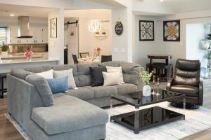 a living room with a couch and a table at DFW Spacious Cozy Modern Villa in Grand Prairie