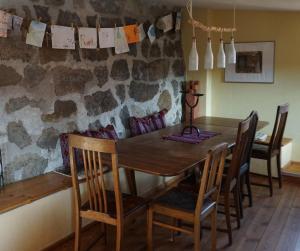 a dining room with a wooden table and chairs at Ferien im Denkmal an der Elbe in Stadt Wehlen