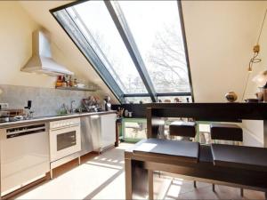 a kitchen with a large skylight in the ceiling at Apartment Immas Welt by Interhome in Utting am Ammersee