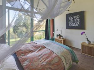 a bedroom with a bed and a large window at Apartment Immas Welt by Interhome in Utting am Ammersee