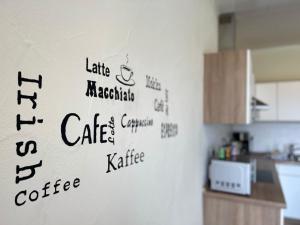 a wall with writing on it in a kitchen at Apartment Kommerswag by Interhome in Pittenbach