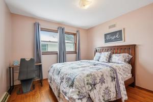 a bedroom with a bed and a window at CBI Haven 1 & 2 in Milwaukee