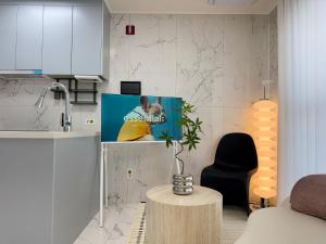 a living room with a tv and a table at 2BR City Hall Station 6min, Myeongdong & Namsan Stay in Seoul