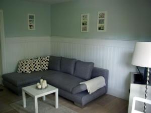 a living room with a couch and a table at Apartment Seerose by Interhome in Bleckede