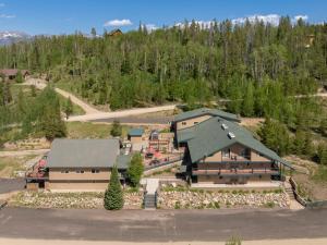 an aerial view of a building with a green roof at Hideaway Mountain Lodge in Fraser