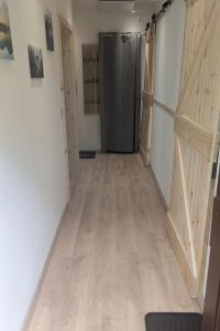 a hallway with two doors and a refrigerator at Apartment Wittle by Interhome in Weiler-Simmerberg