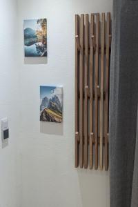 a wall with pictures and photographs on a wall at Apartment Wittle by Interhome in Weiler-Simmerberg +19 photos