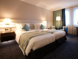 Gulta vai gultas numurā naktsmītnē Le Royal Hotels & Resorts Luxembourg