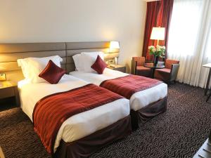 Rúm í herbergi á Le Royal Hotels & Resorts Luxembourg