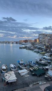 a bunch of boats are docked in a harbor at Tower casa vacanze 2 in Anzio