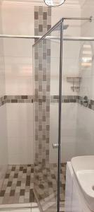 a glass shower in a bathroom with a sink at 27 on Donaldbain in Welkom +11 photos