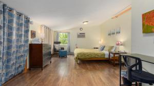 a bedroom with a bed and a desk in a room at Three Connected Quirky Condos By Beach! - Twilight Condo in Pepin +34 photos