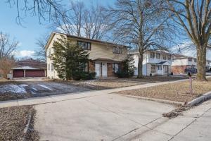 a house on a street with a driveway at CBI Haven 1 & 2 in Milwaukee