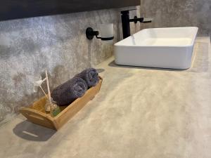 a bathroom with a sink and a bath tub at Nomads Kite House in El Cuyo +45 photos