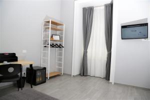 Televízia a/alebo spoločenská miestnosť v ubytovaní B&B Pika 48