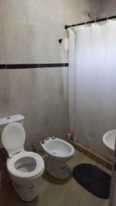 a bathroom with a toilet and a sink at Tunquelen II in Colorado River