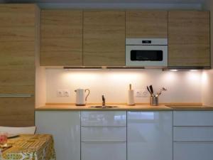 a kitchen with white cabinets and a stove top oven at Apartment by Interhome in Cambo-les-Bains