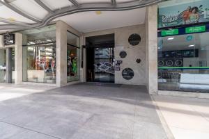 a store front with glass doors in a building at STUDIO/ESTÚDIO TOP - Praia 200M & Lazer Incrível / Stylish Stúdio - 200M Beach & Great Amenites in Maceió