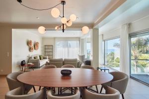 a dining room with a table and chairs at Luxury Retreat with Pool & Views in São Roque