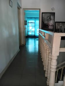 a hallway with a long hallway with a door at Angels Negombo in Negombo
