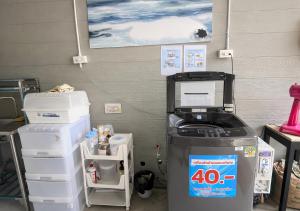 an office with a fax machine and other items at MBB House in Thalang +12 photos