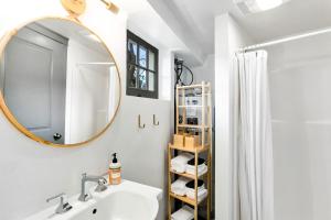 a bathroom with a sink and a mirror at Montlake Studio in Spite House in Seattle +14 photos