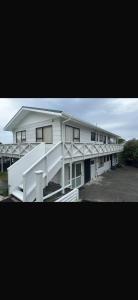 a large white building with a lot of windows at Beachfront Bliss in Snells Beach