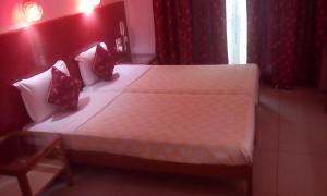 Letto o letti in una camera di Ray of Maya