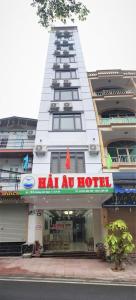 a building with a hotel sign in front of it at Seagull Hotel in Cat Ba