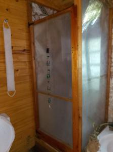 a wooden door with a glass bead hanging from it at Cabaña Lo de VIVI in Casa Grande
