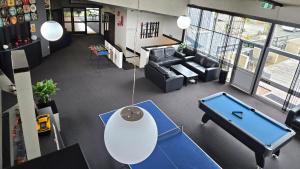 an overhead view of a living room with a ping pong table at Fiordland Hotel in Te Anau