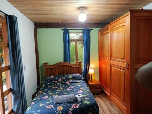 a bedroom with a bed and a window at Moss in Colombia