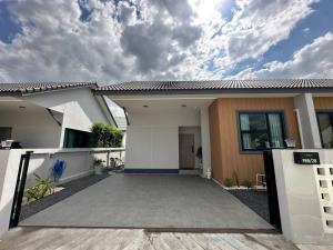 a house with a driveway in front of it at 2 Bedroom Modern House in Ban Nong Chaeng