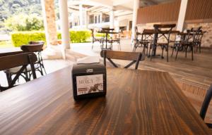 a suitcase sitting on top of a table in a restaurant at Hotel Mercy in San Juan La Laguna +126 photos