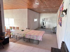 a large room with a table and chairs in it at Casa quinta oro verde in Oro Verde