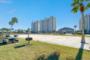 a park with a picnic table and palm trees and buildings at Catalina 902-Updated Beachfront Condo with Amazing Views-Full Service Resort in Gulf Shores +62 photos