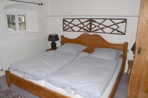 Un pat sau paturi într-o cameră la Windshausen 84