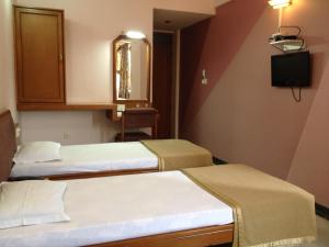 Postel nebo postele na pokoji v ubytování Hotel GRG