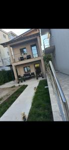 a large house with a fire hydrant in front of it at Garsoniera Veronica in Mangalia