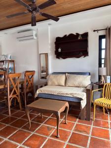 a living room with a couch and a table at Serenita Tagaytay in Kibagan