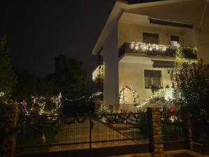 a house is decorated with christmas lights at Casa a 4 zampe in Gorizia