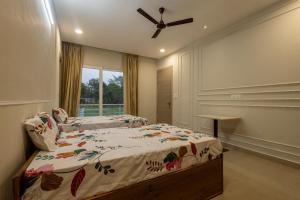 a bedroom with a bed and a ceiling fan at Chauhan Farms in Jāmb