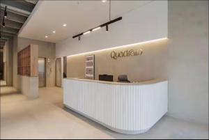 an office with a white counter with a sign on the wall at Laureles Studios - Tomas in Medellín