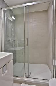 Koupelna v ubytování Hotel Alexander