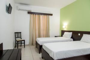 Postel nebo postele na pokoji v ubytování Rio Hotel