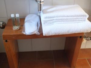 a table with towels on it in a bathroom at Relais Cà Nova Guest House in Bogogno +46 photos