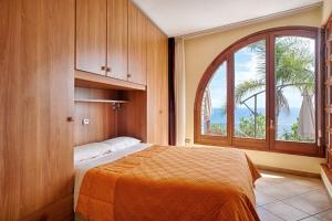 A bed or beds in a room at Le Terrazze Appartamenti Vacanze
