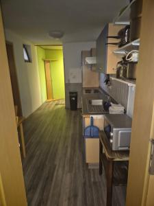 a kitchen with a sink and a counter top at Monteurwohnung in Frielendorf