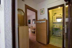 a room with a bathroom with a sink and a toilet at Apartments Petrič in Koper